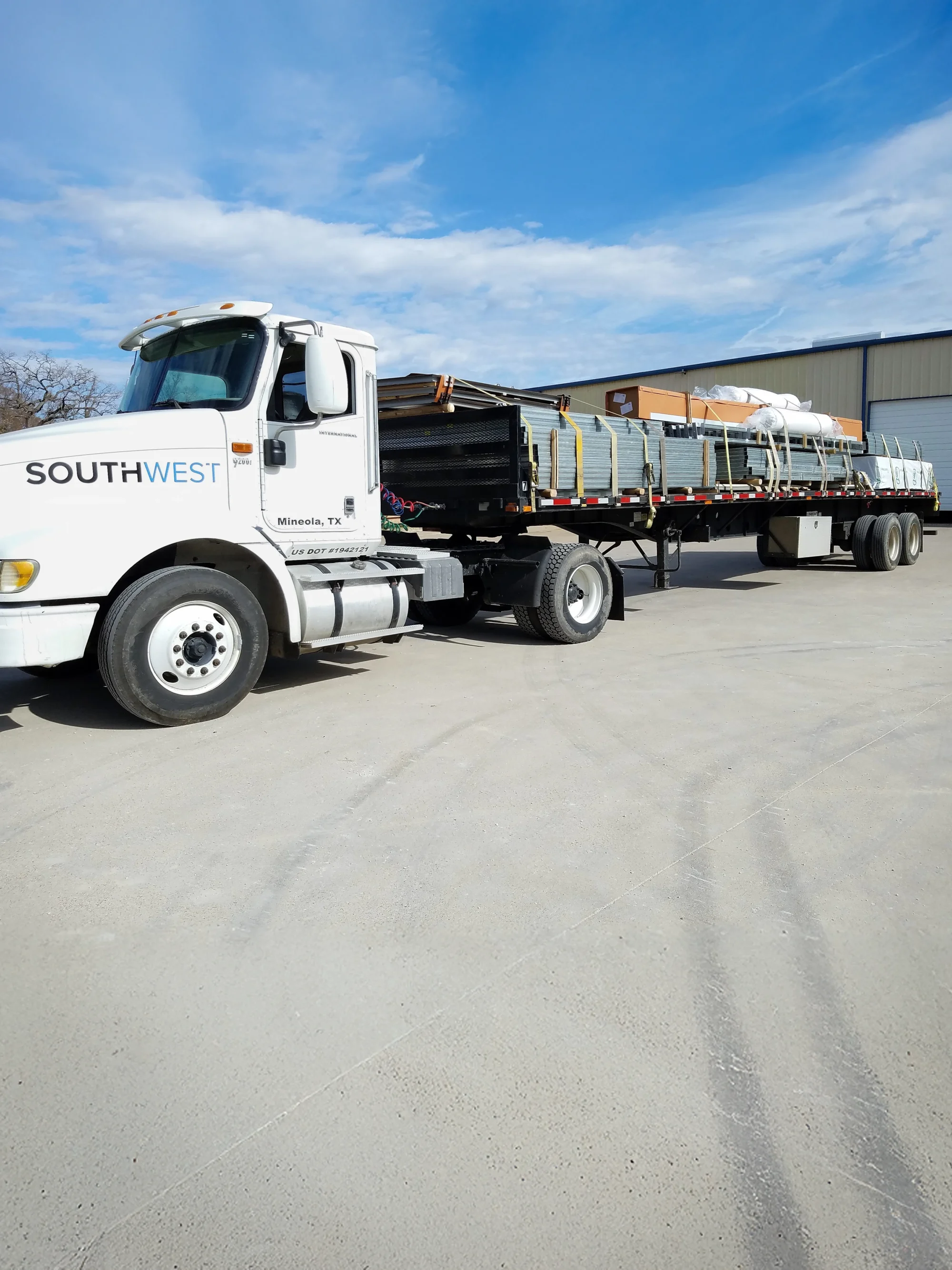delivery truck loaded with steel building materials