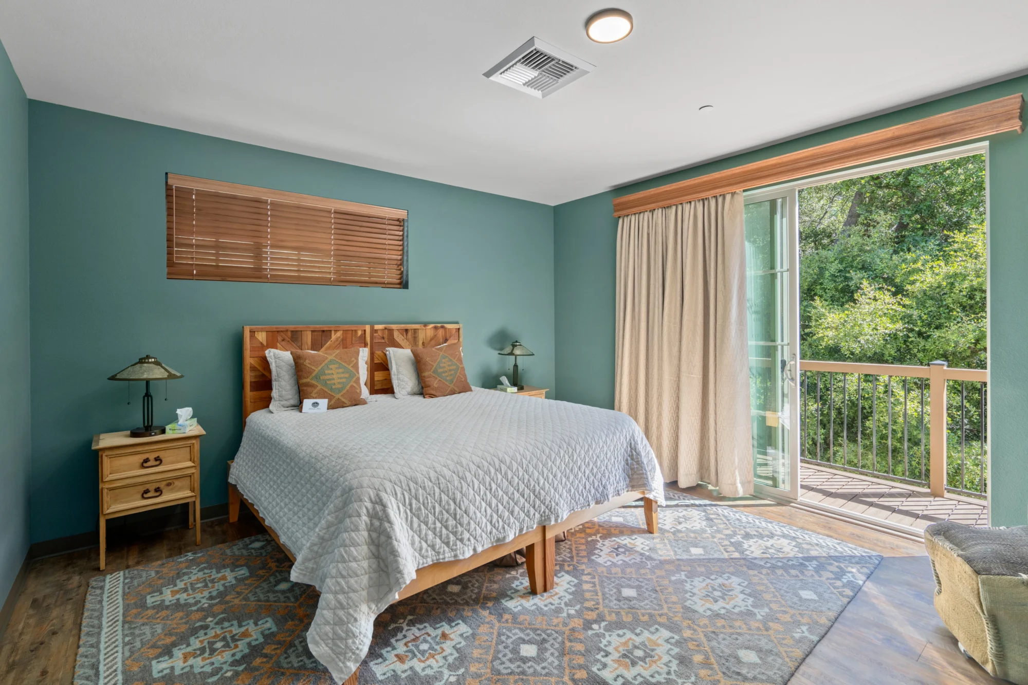 2bed 1bath cedar ridge cabin bedroom wood headboard forest view