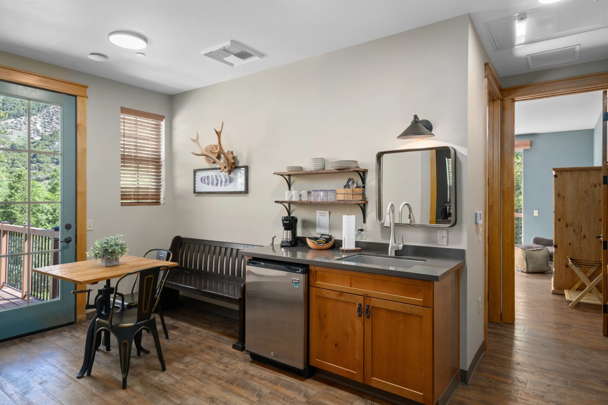 2bed 1bath cedar ridge cabin kitchen dining area antler decor