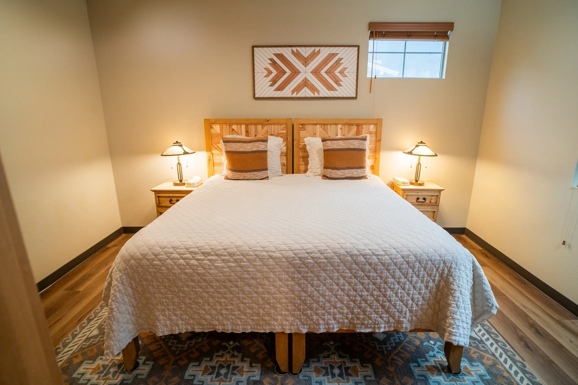 2bed 1bath the pines master bedroom foot view southwestern rug