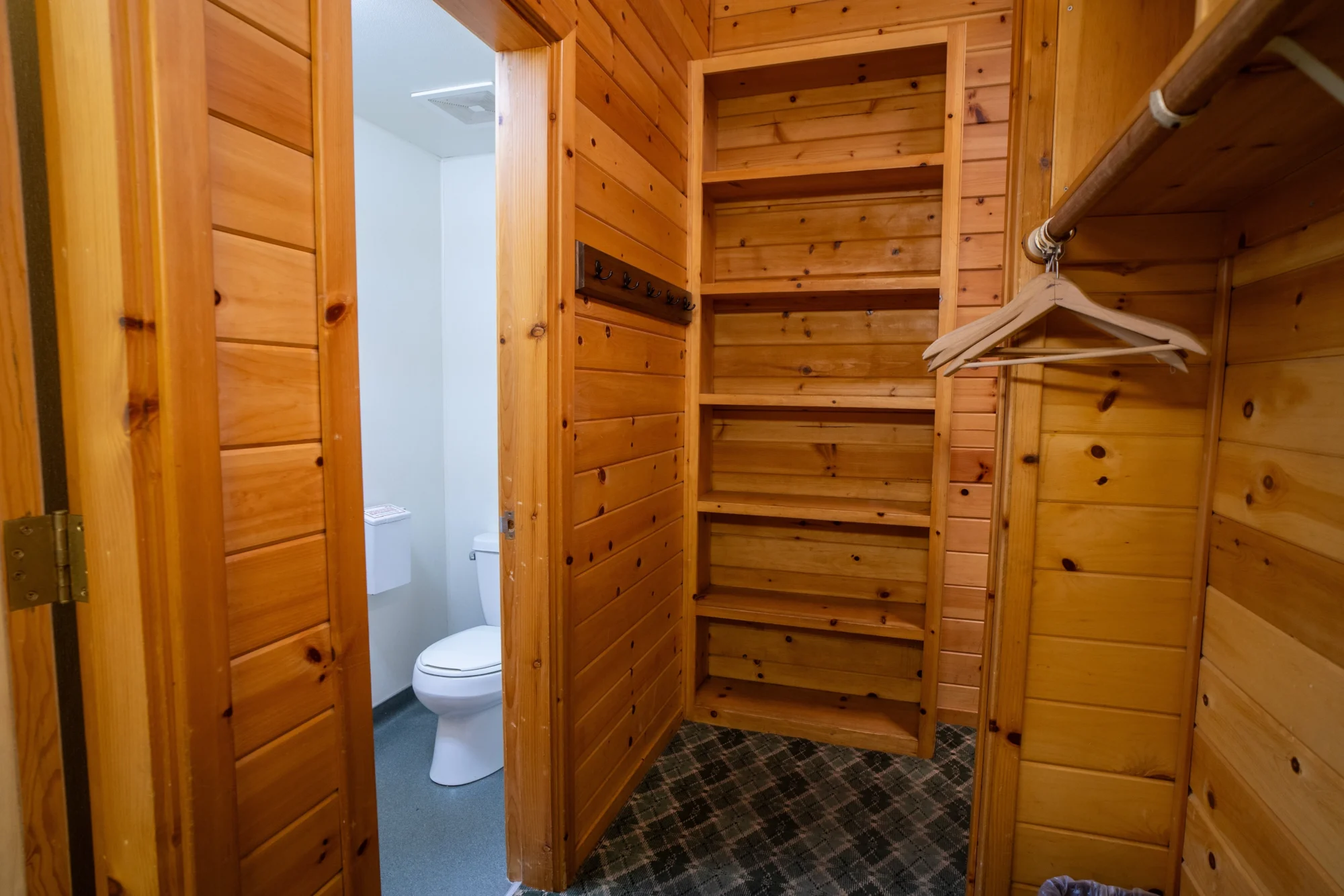 classic studio lodging closet shelves bathroom entry