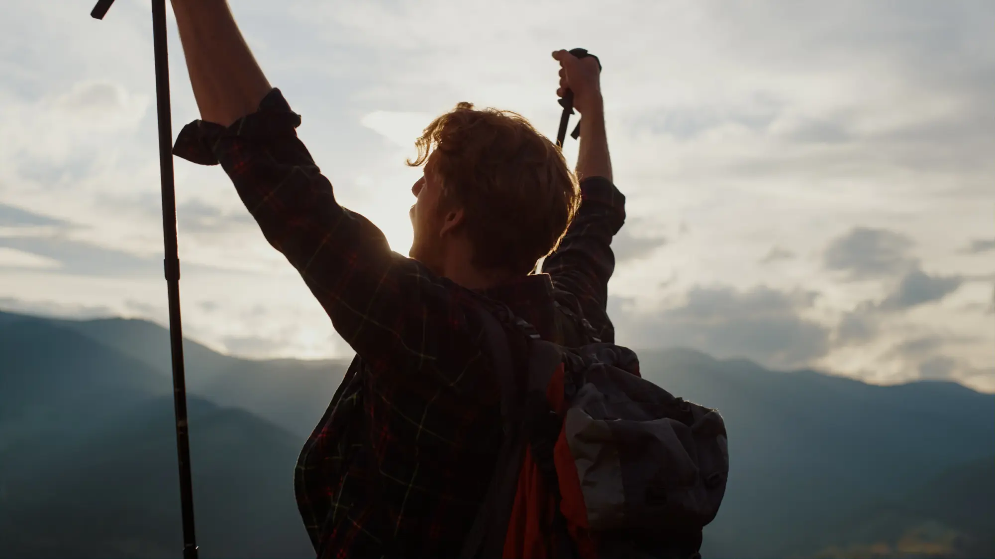 closeup euphoric hiker celebrate raise hands in mo 2026 01 05 23 34 36 utc