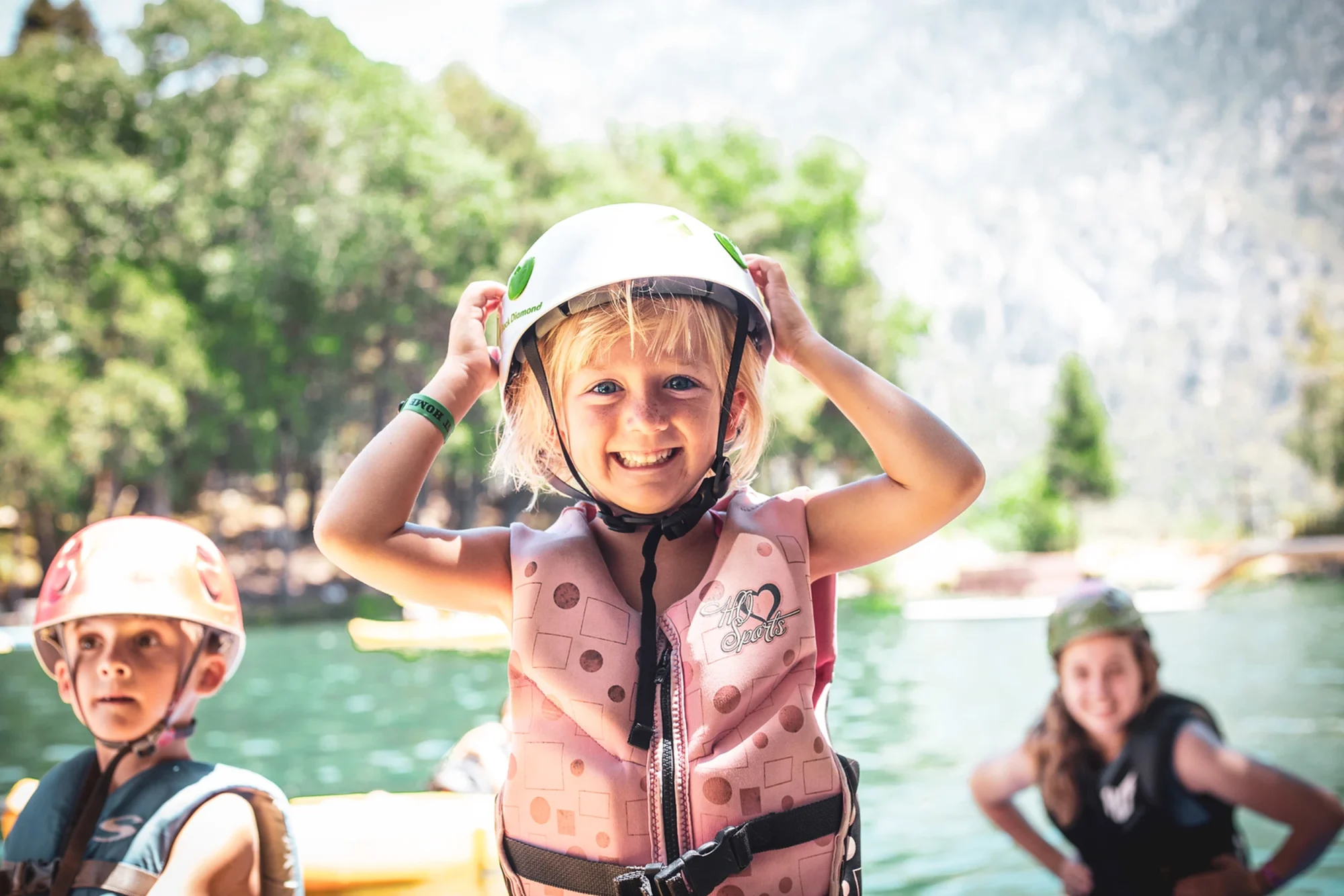 critter kids girl helmet lifejacket lake activity