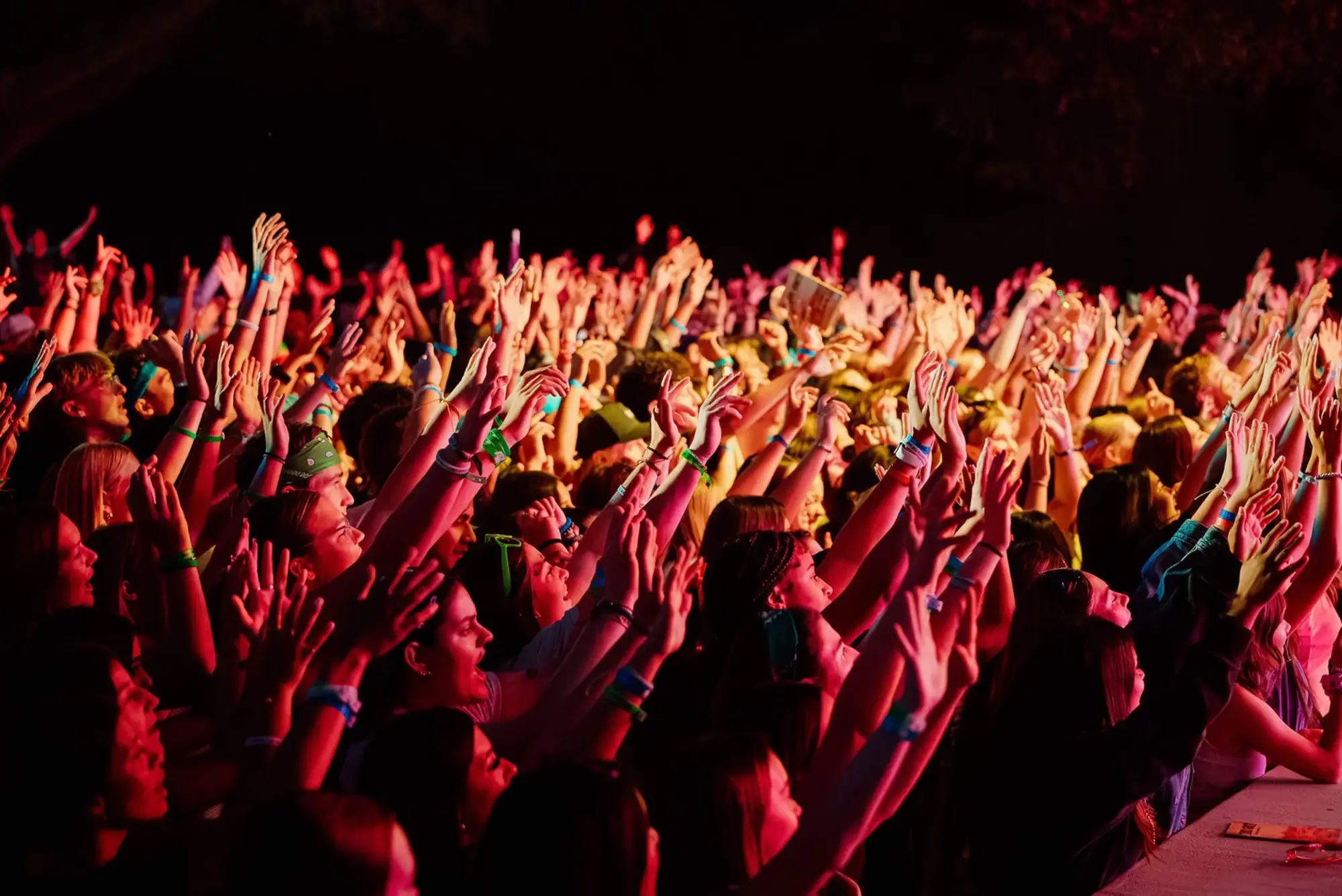 crowd hands raised worship