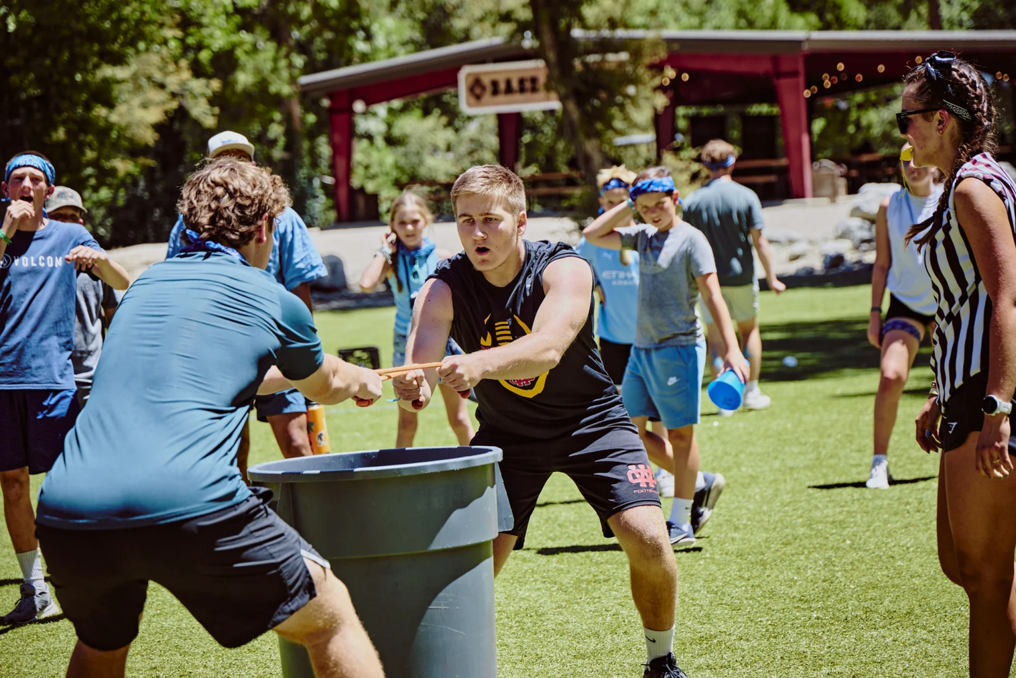 family camp basecamp teens water bucket relay race field