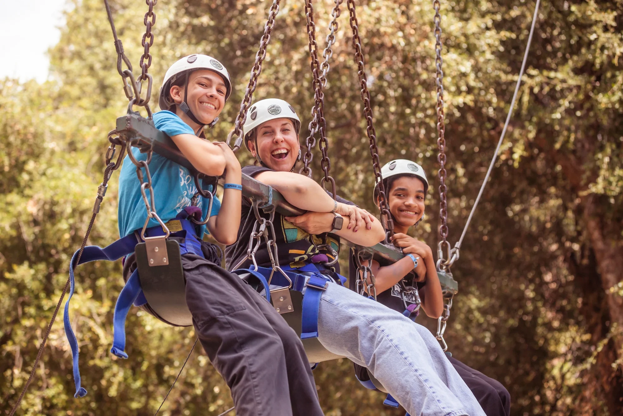 family camp giant swing mom two boys smiling