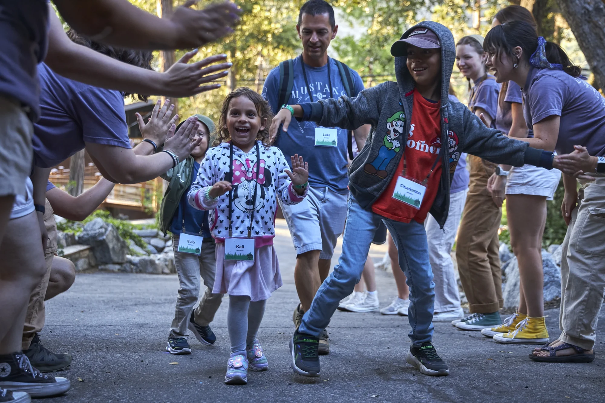 Families gathered outdoors in the morning at Forest Home