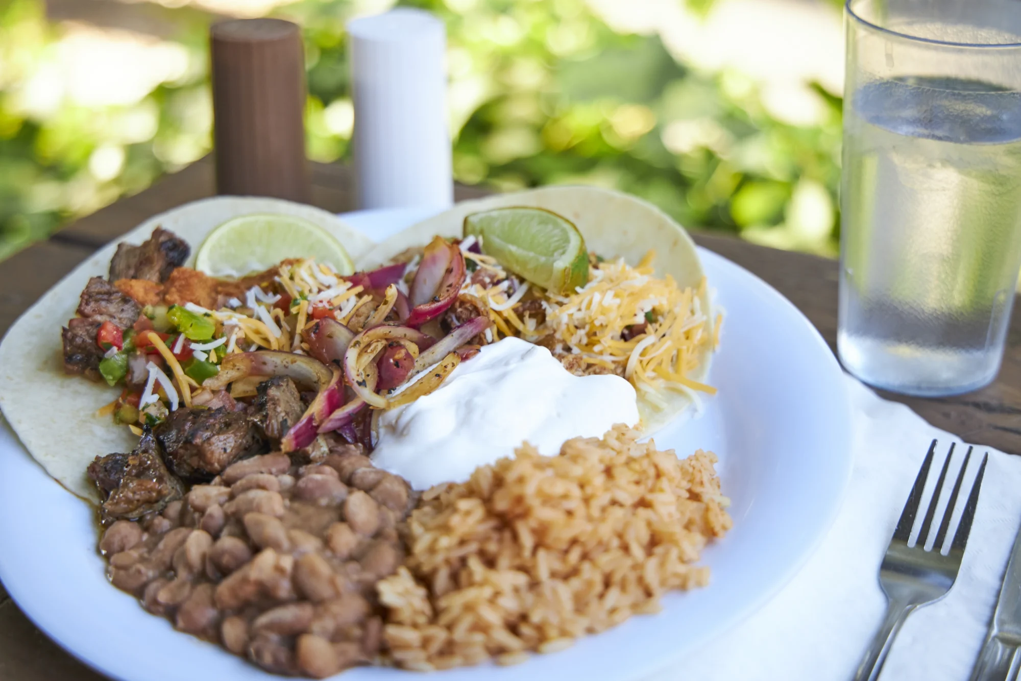 food family camp mexican tacos cheese sour cream closeup