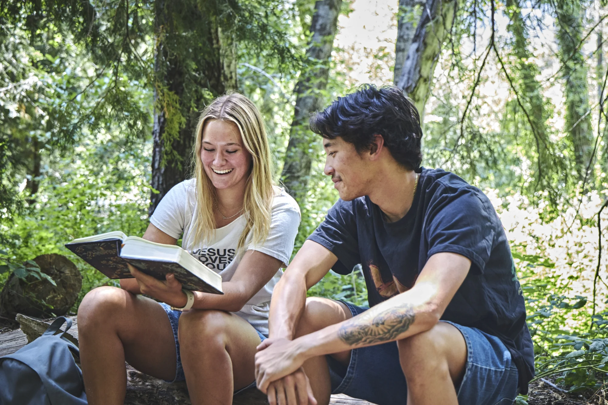 go year couple reading bible together forest