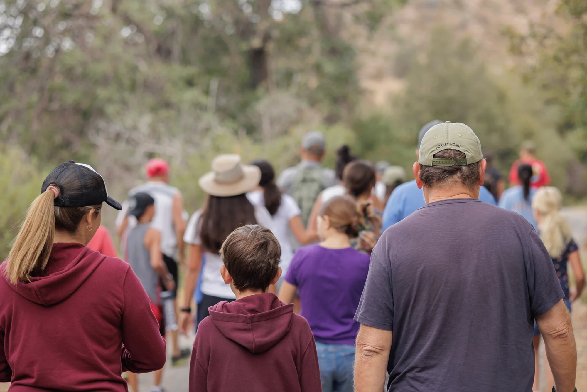 group trek hiking trail families walking nature