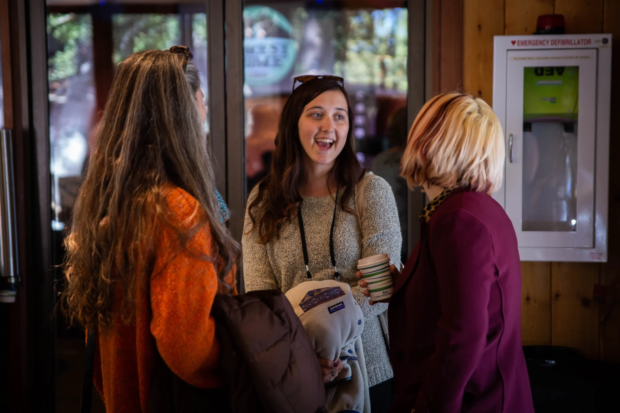guest retreats women chatting laughing lodge interior