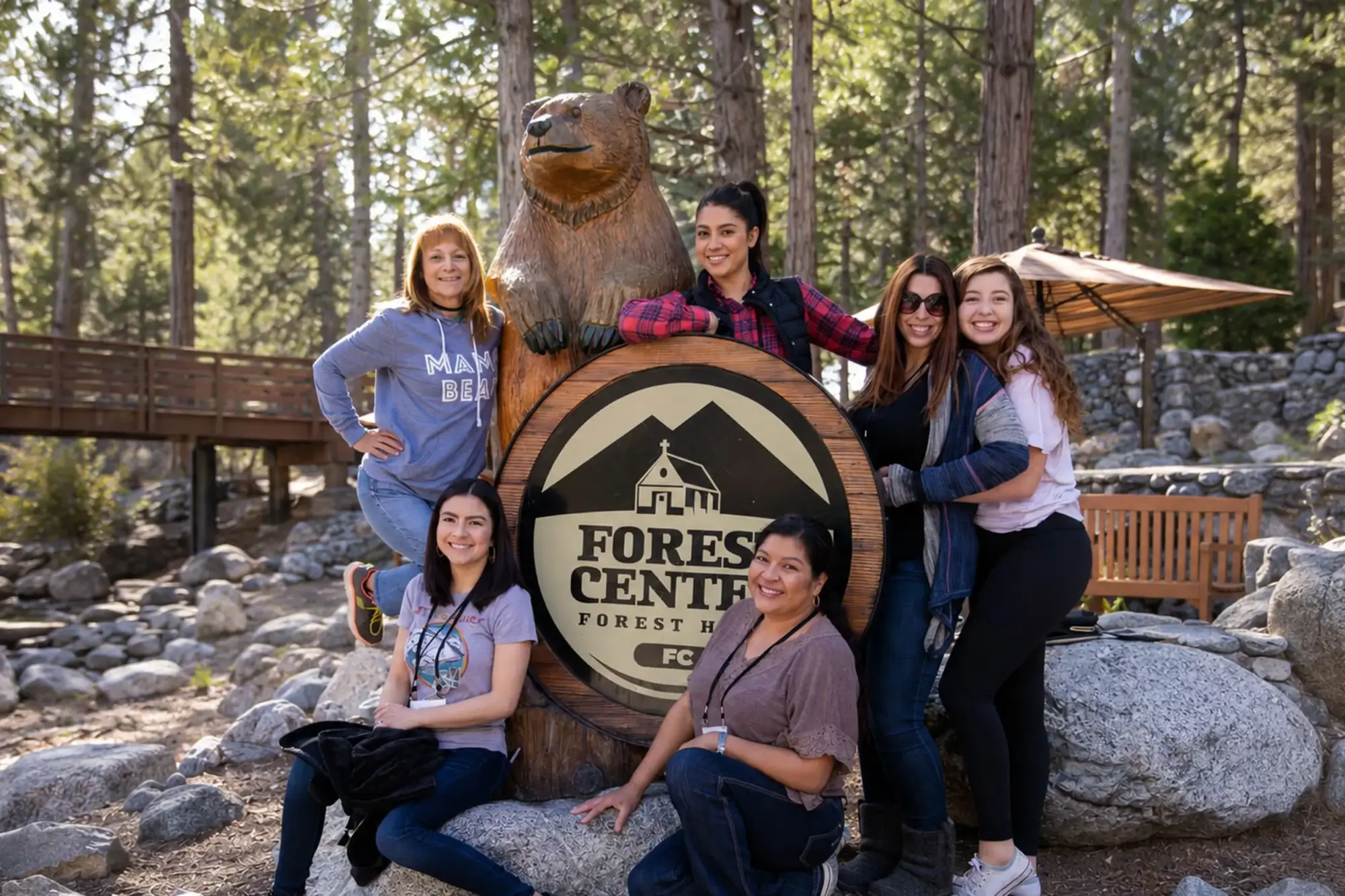 guest retreats women group photo forest home sign wide e3