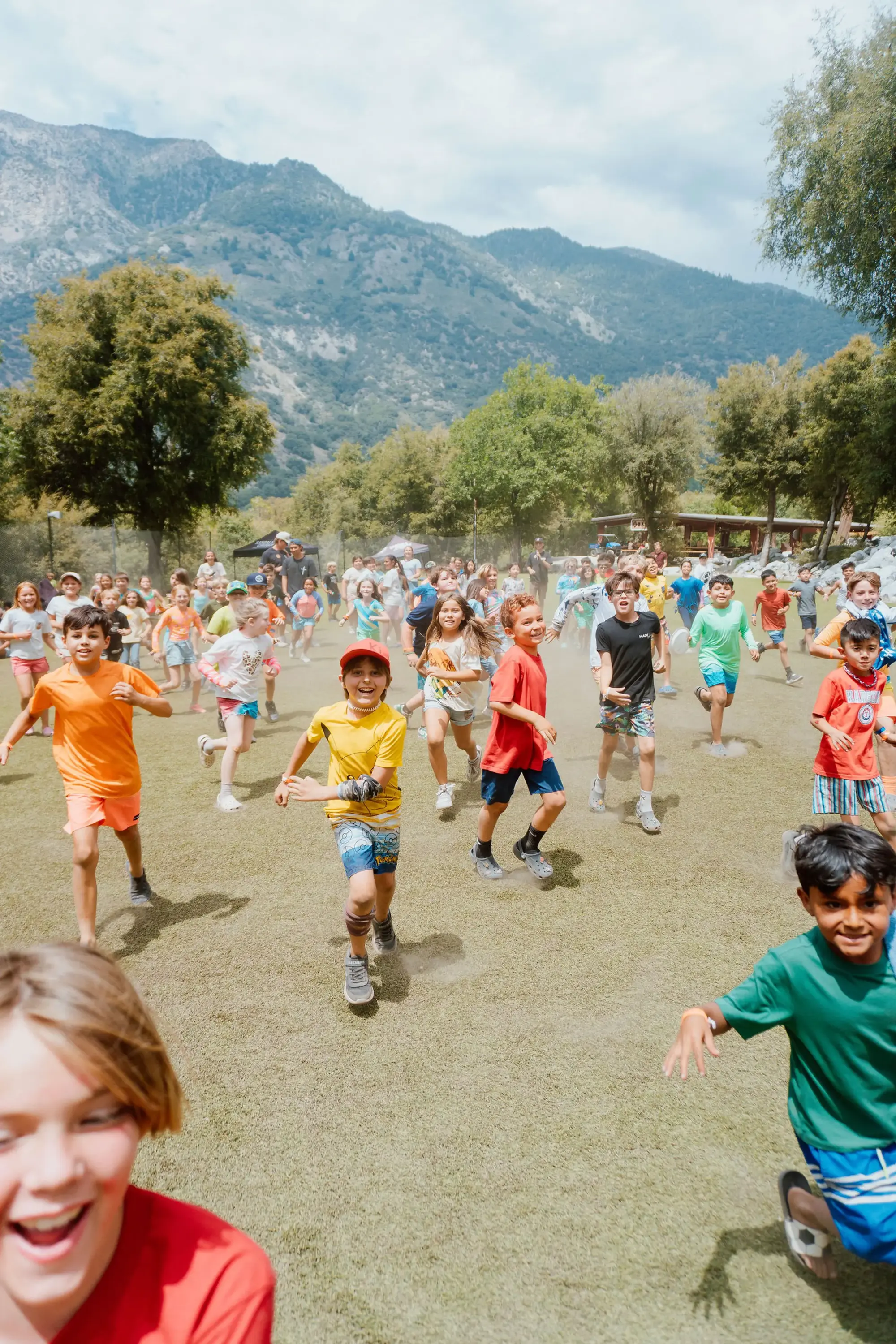 kids running basecamp field
