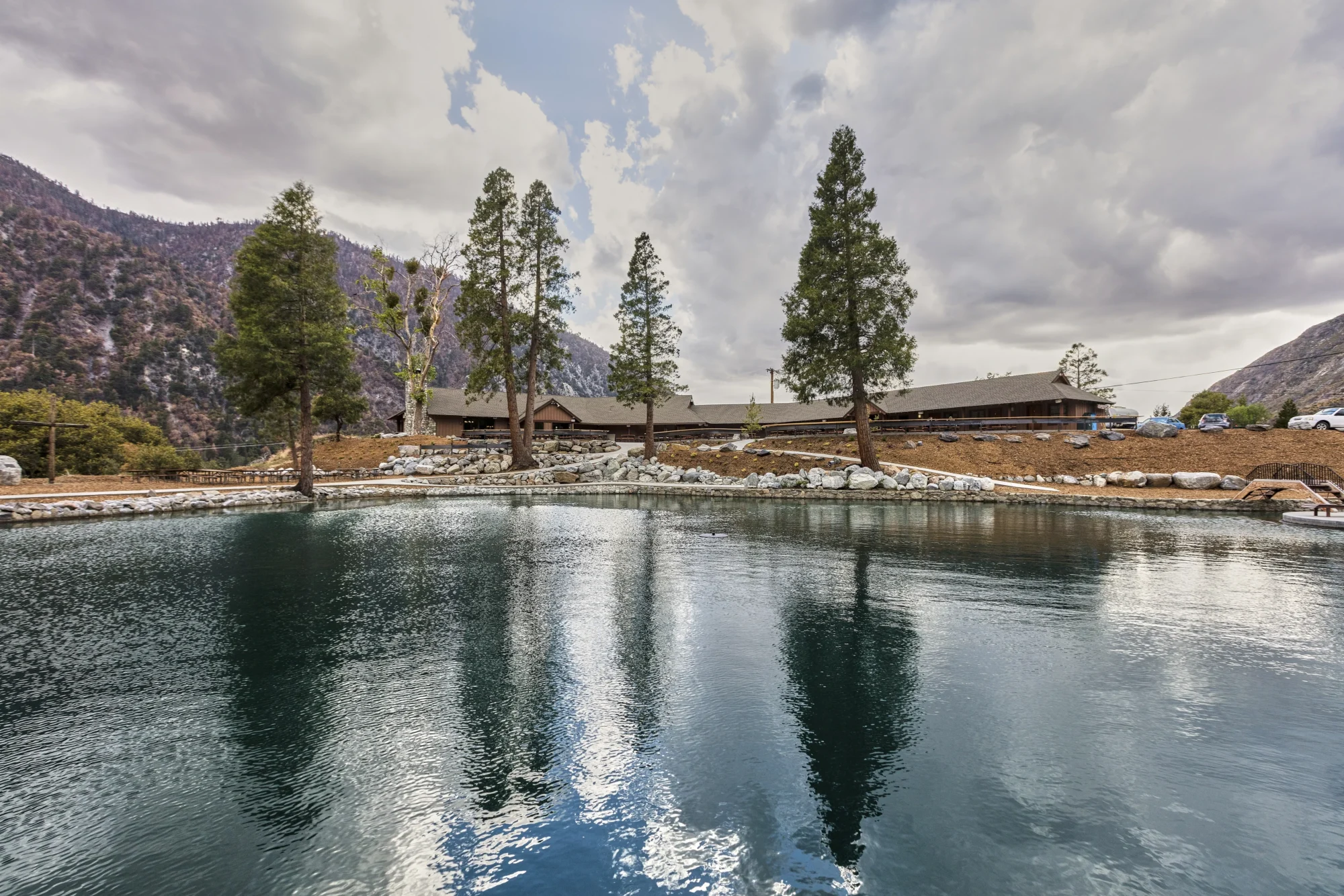 lakeview property lake reflection lodge pine trees mountain