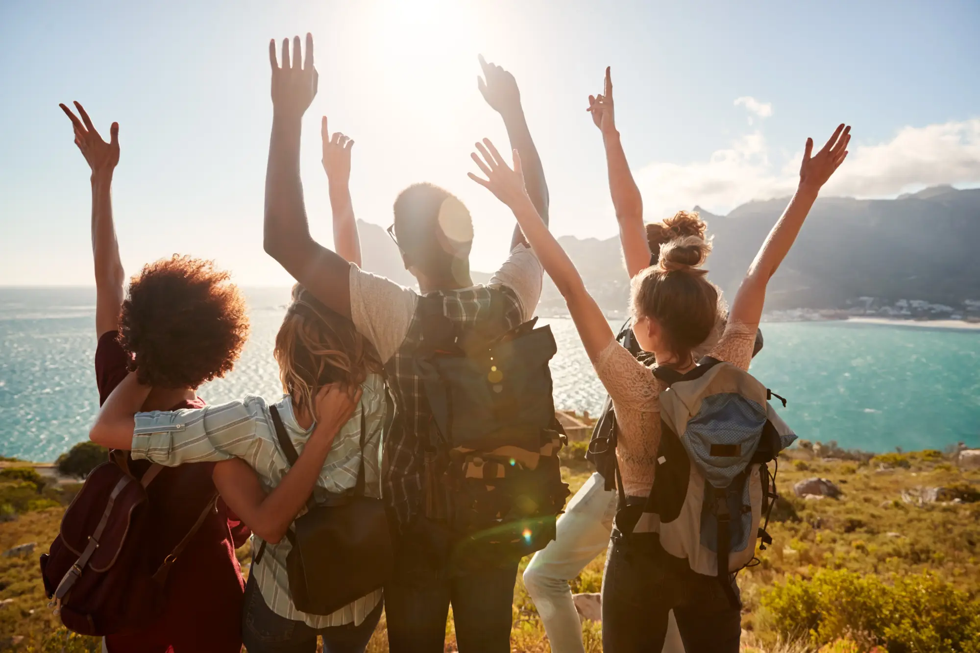 millennial friends on a hiking trip celebrate reac 2026 03 10 03 58 45 utc