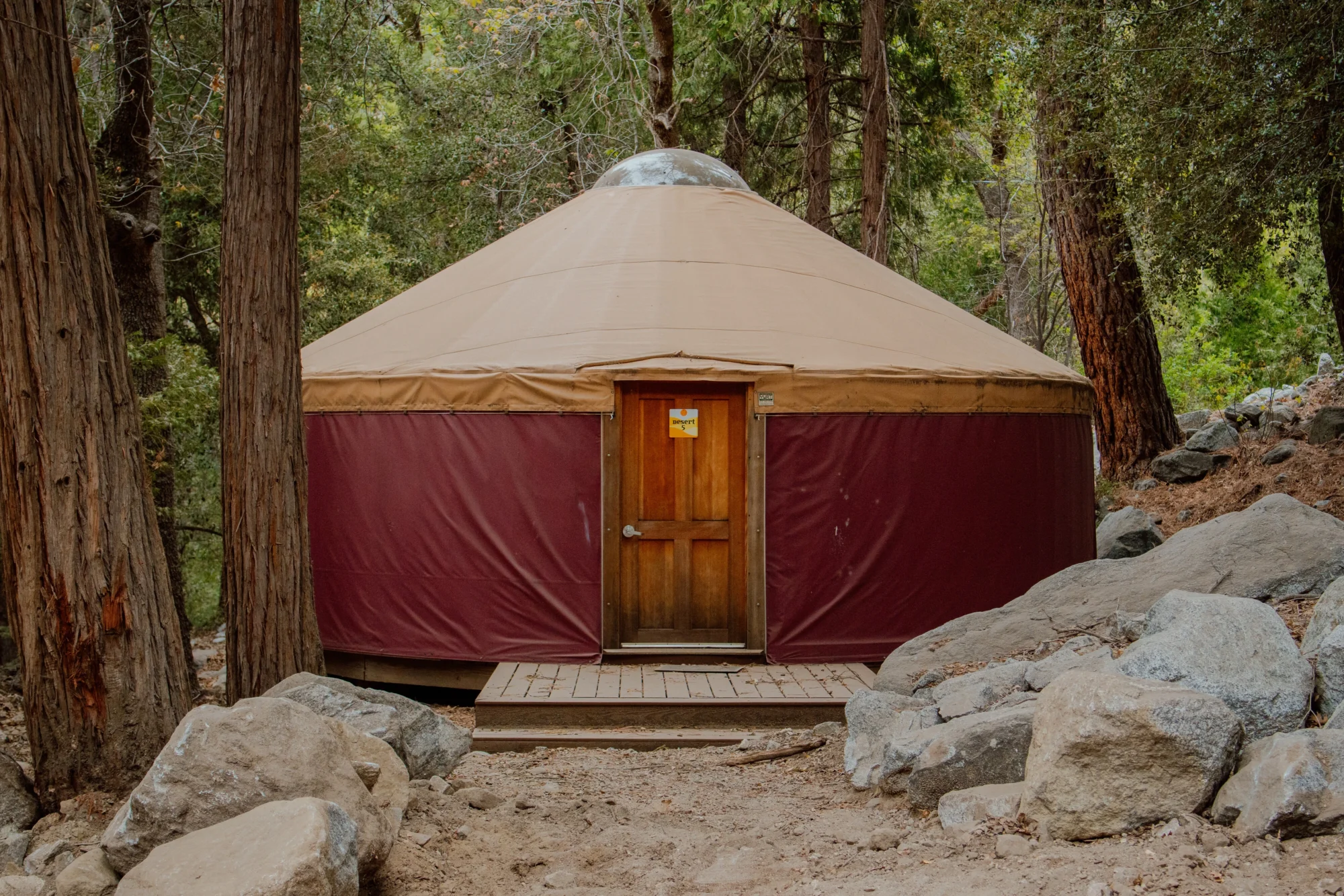 property yurt tent forest boulder entrance