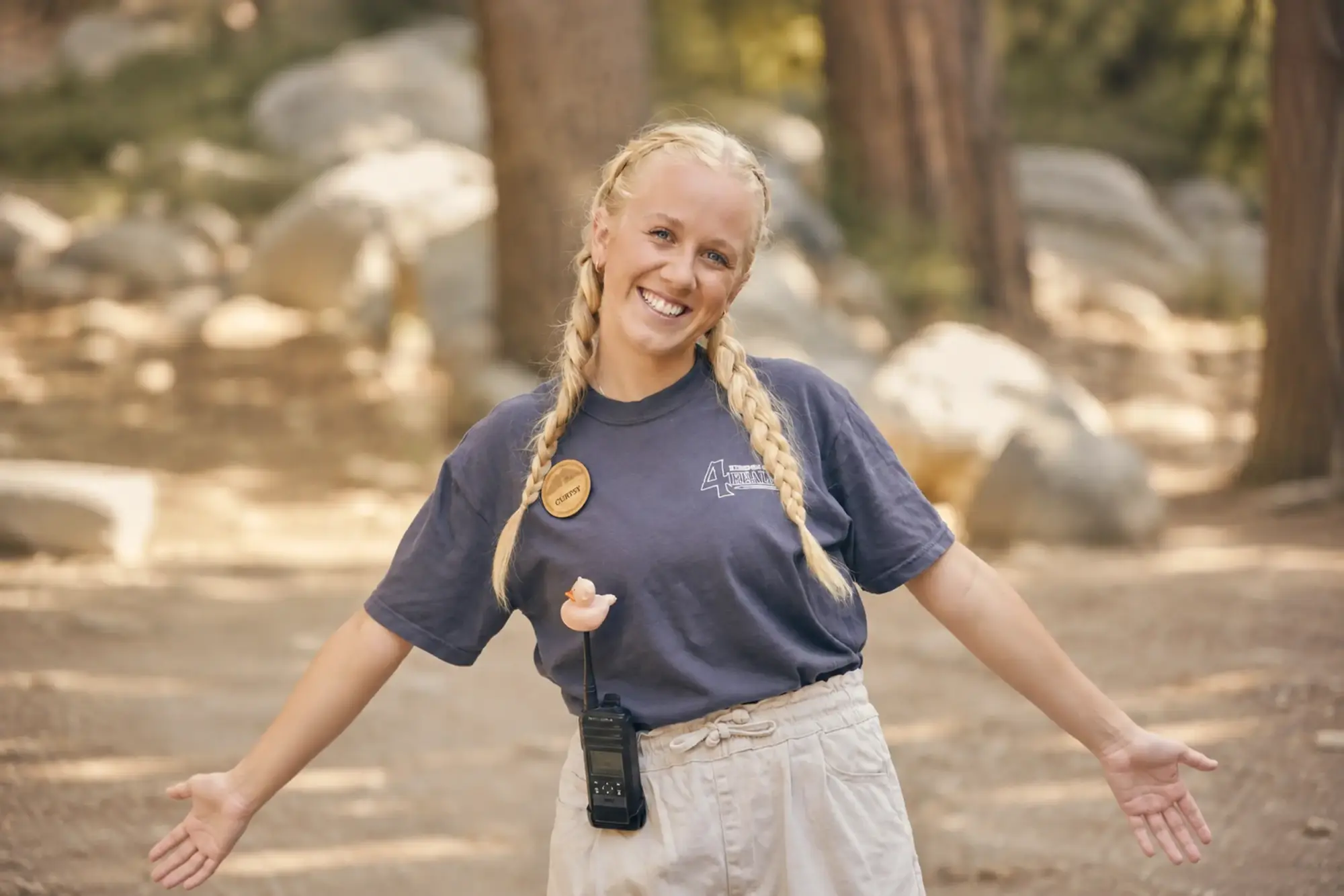 summer staff staff woman portrait braids walkie talkie outdoors e1