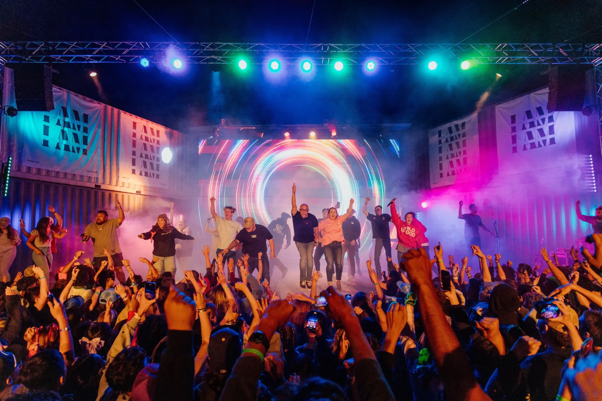 summer youth camp worship concert stage colorful lights crowd