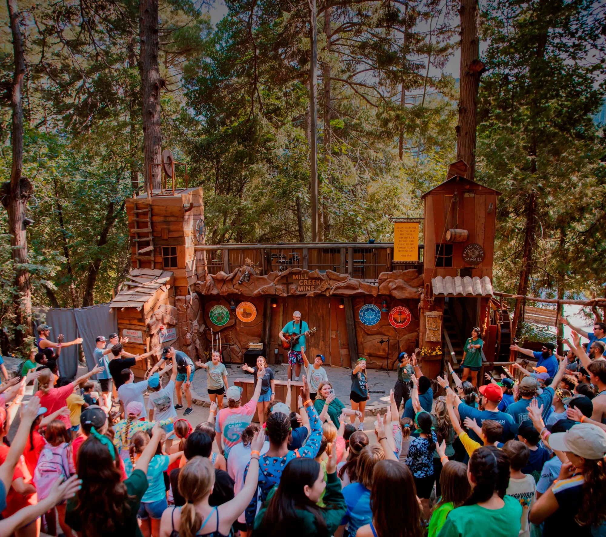 wildrock campers hands raised worship mill creek stage retouched