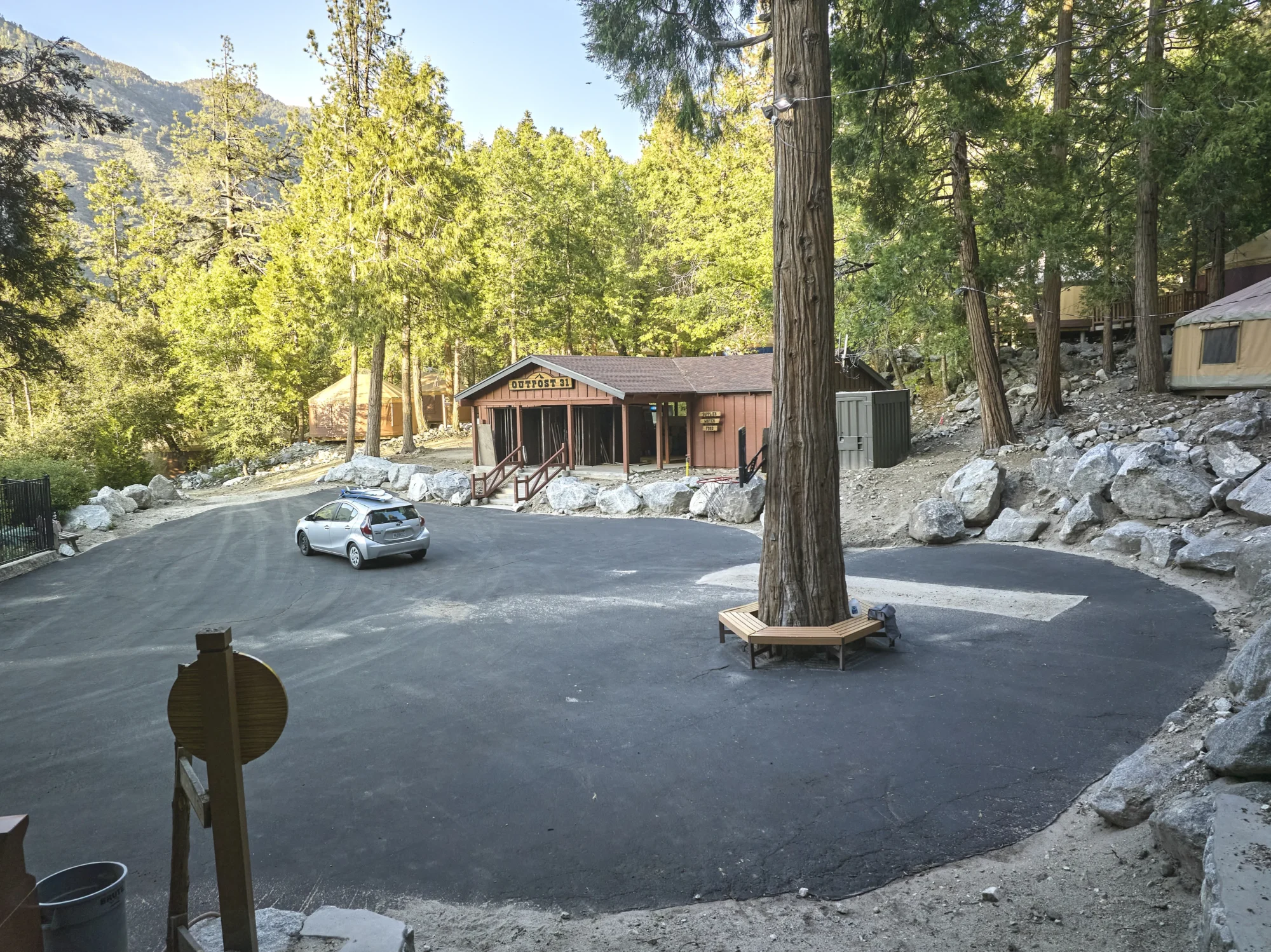 wildrock rustic outpost lodge pine trees rock landscaping