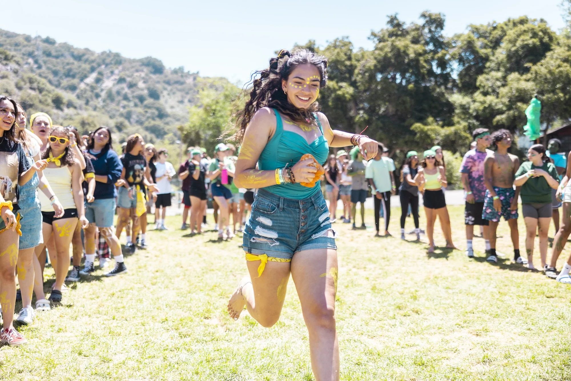 youth camp girl running face paint color competition outdoor
