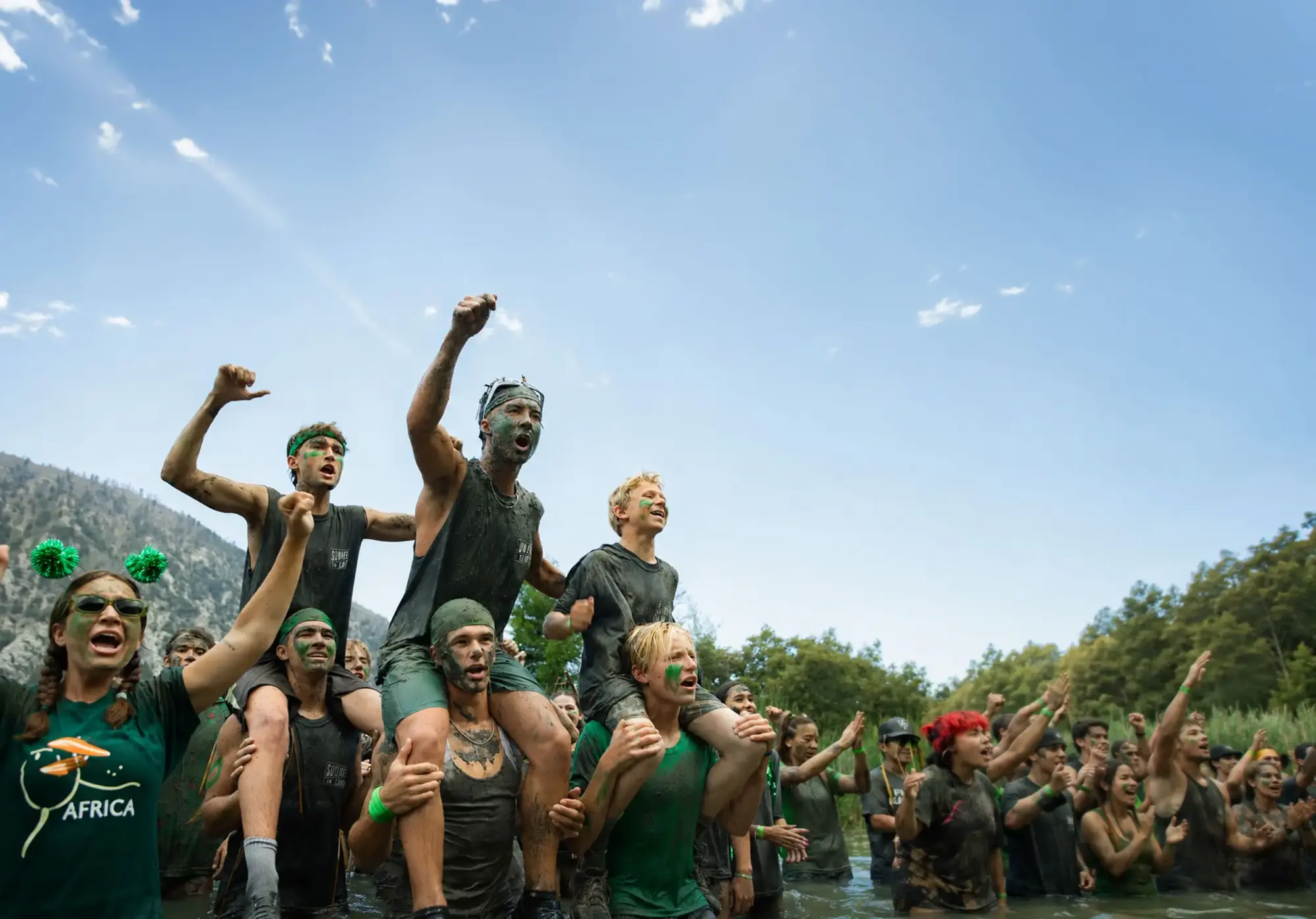 youth campers green team victory celebration mud covered e2
