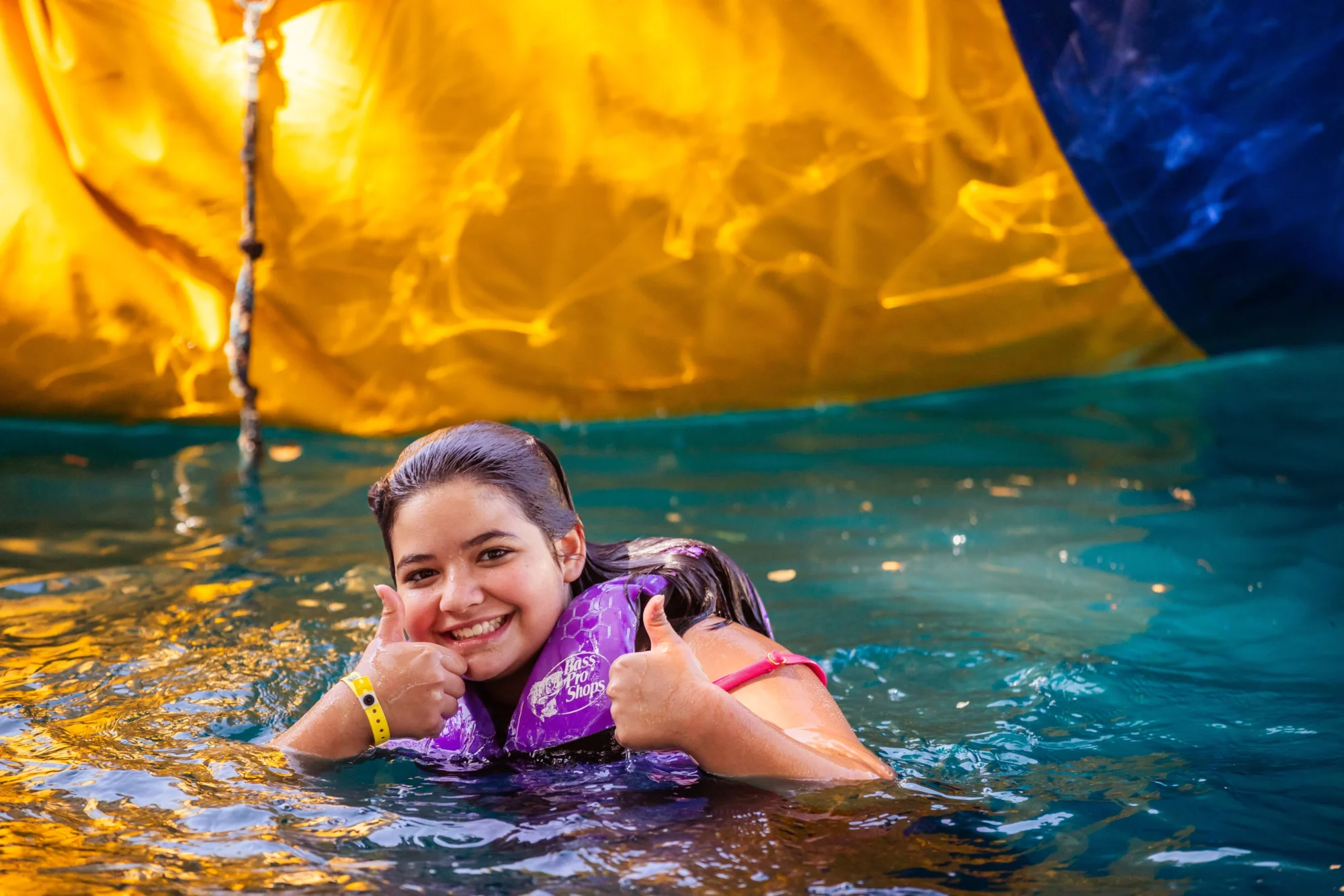 youth girl thumbs up swimming near water blob